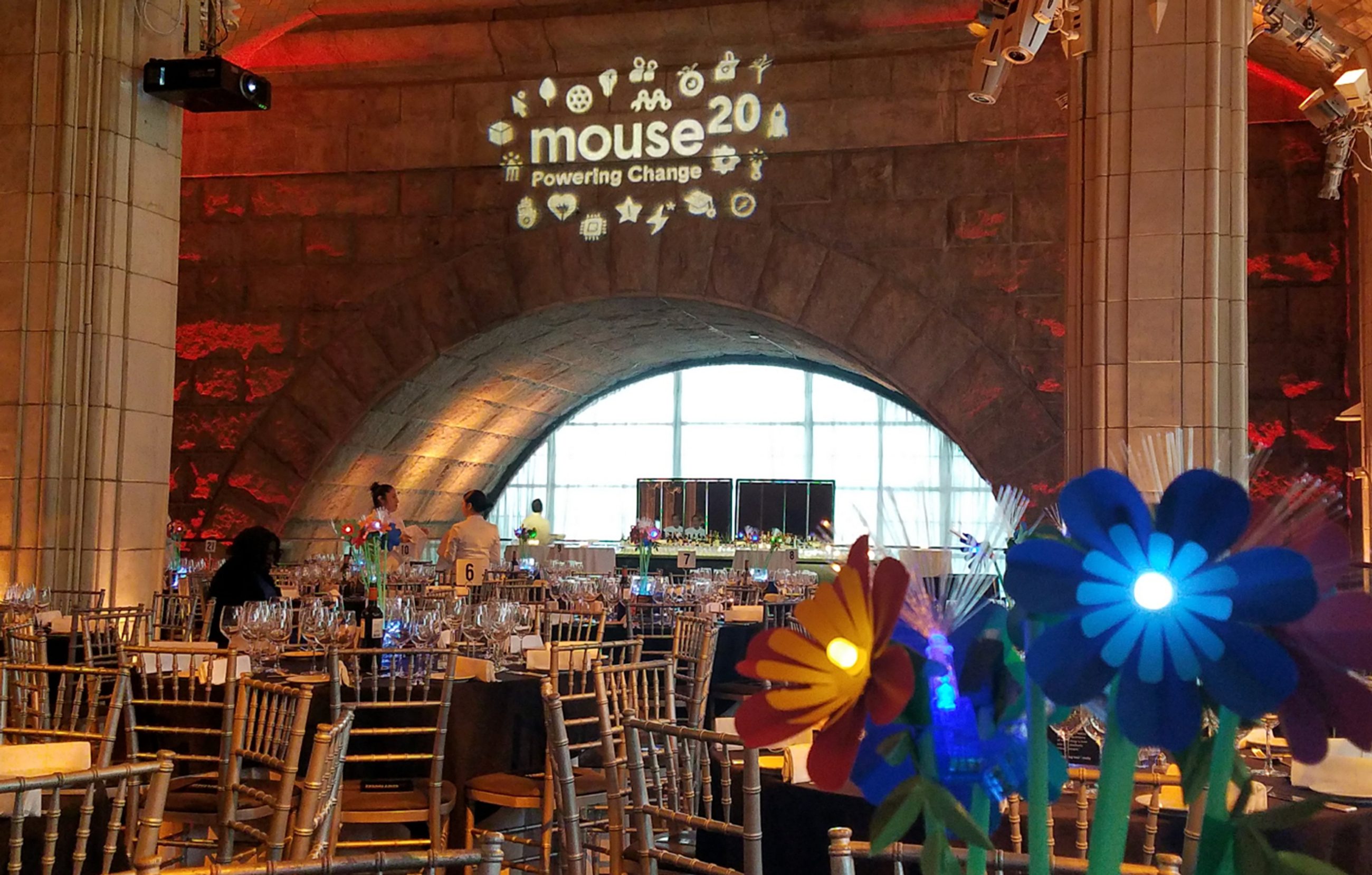Tables with led flowers as centerpieces for youth focused technology nonprofit gala