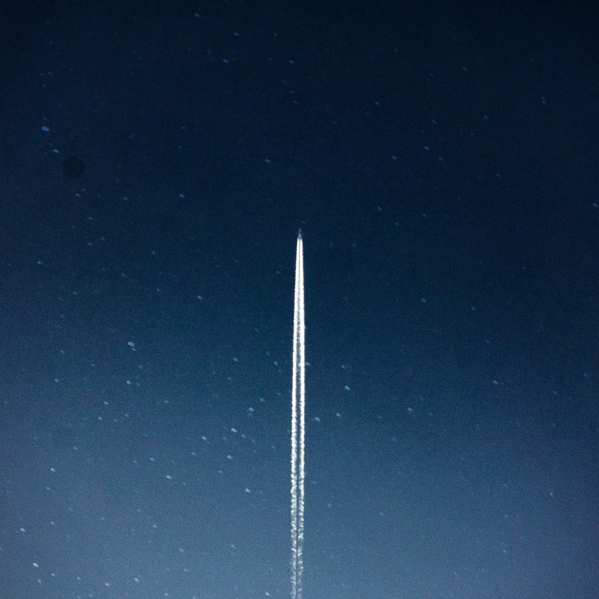 Trails from a space launch in the night sky